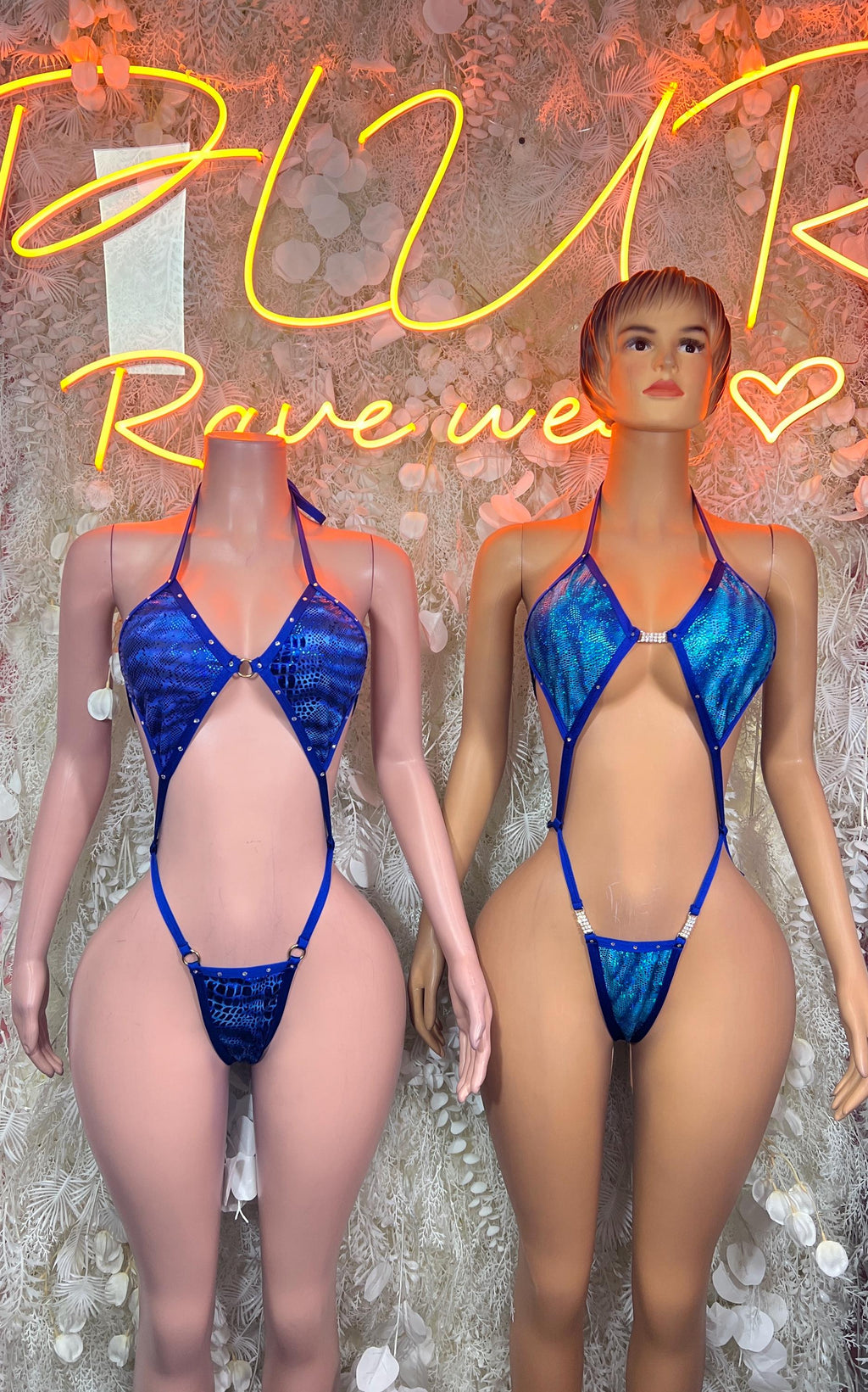Blue snake-print bodysuits on two models with halter plunge front and thong back