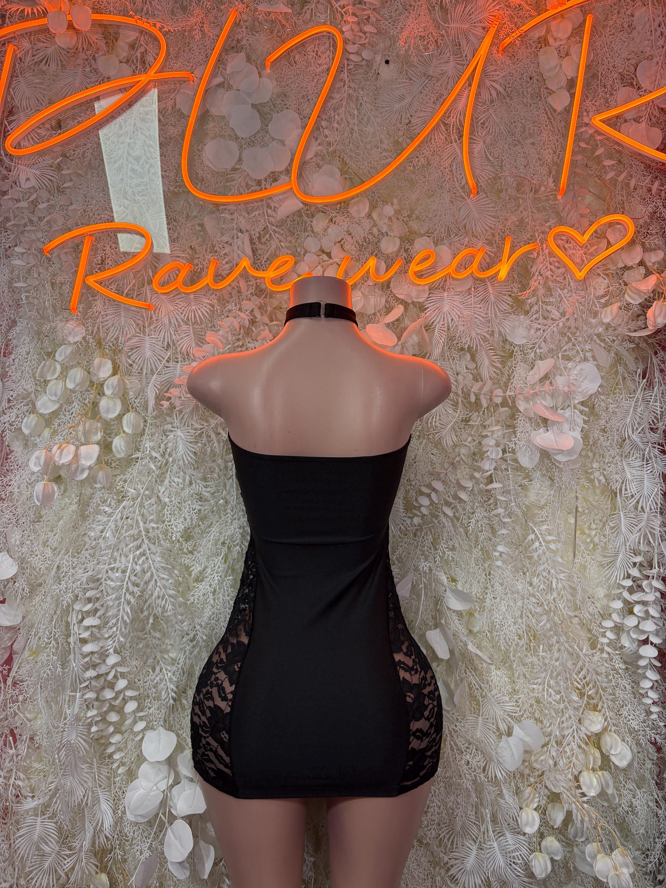 Black mini dress with open back and lace hem
