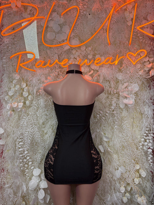 Black mini dress with open back and lace hem
