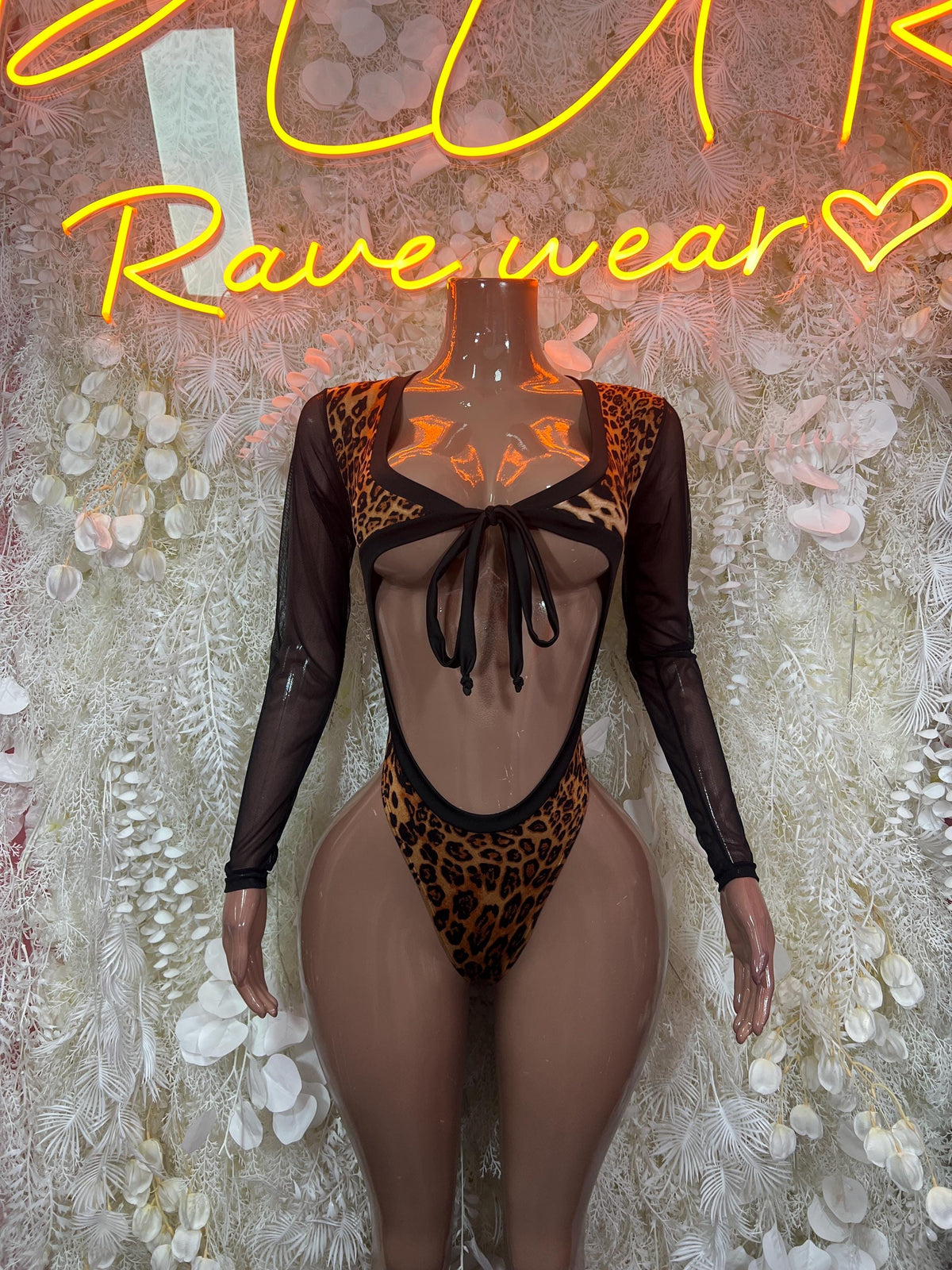 Leopard print one-piece bodysuit with long sheer sleeves and back lace-up cutout