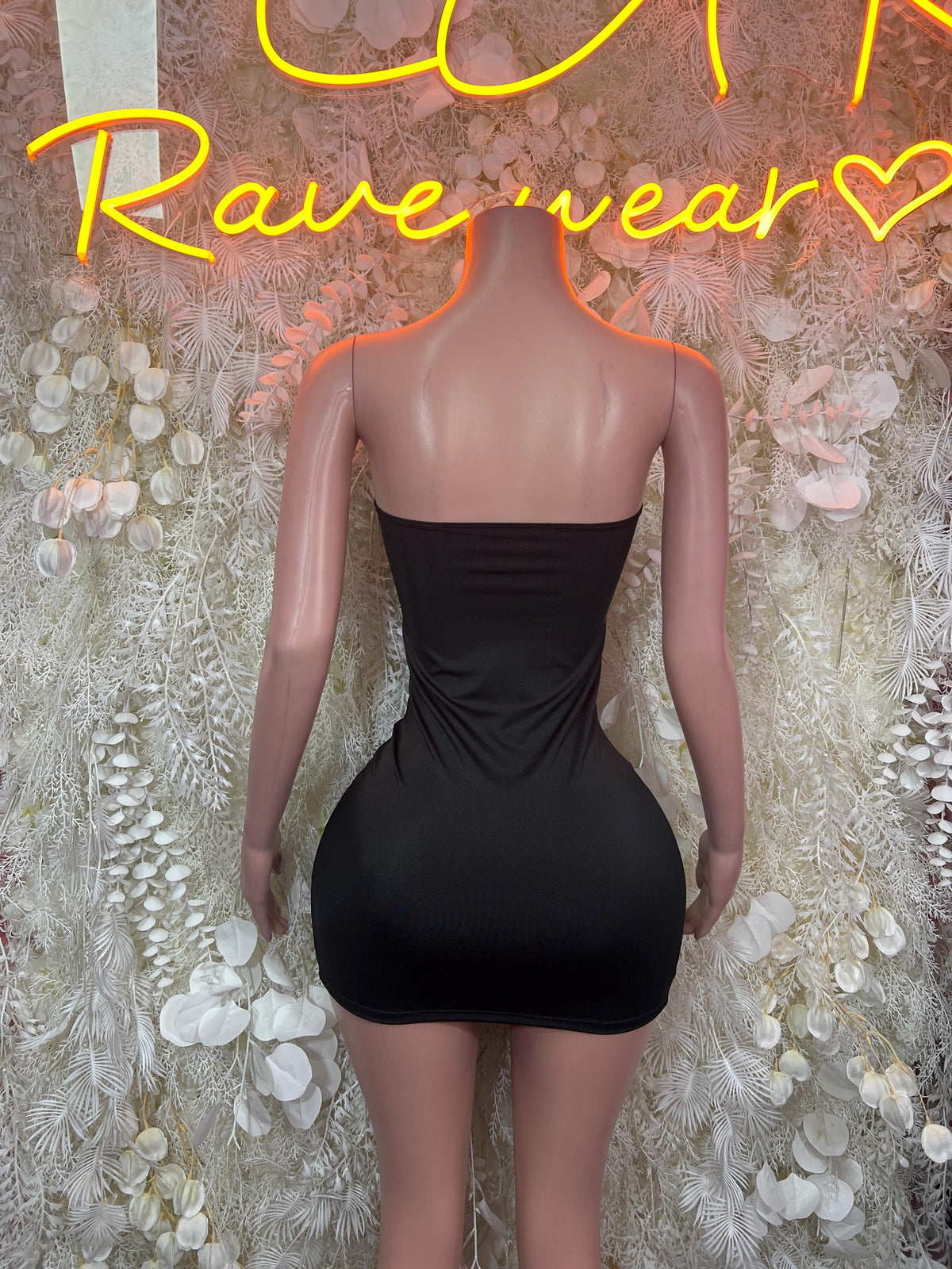 Black strapless mini dress with draped open back and ruched waist seam