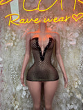 Black fishnet mini dress with deep V neckline and scalloped trim on mannequin