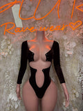 Dark velvet bodysuit with long sleeves and deep V front cutout