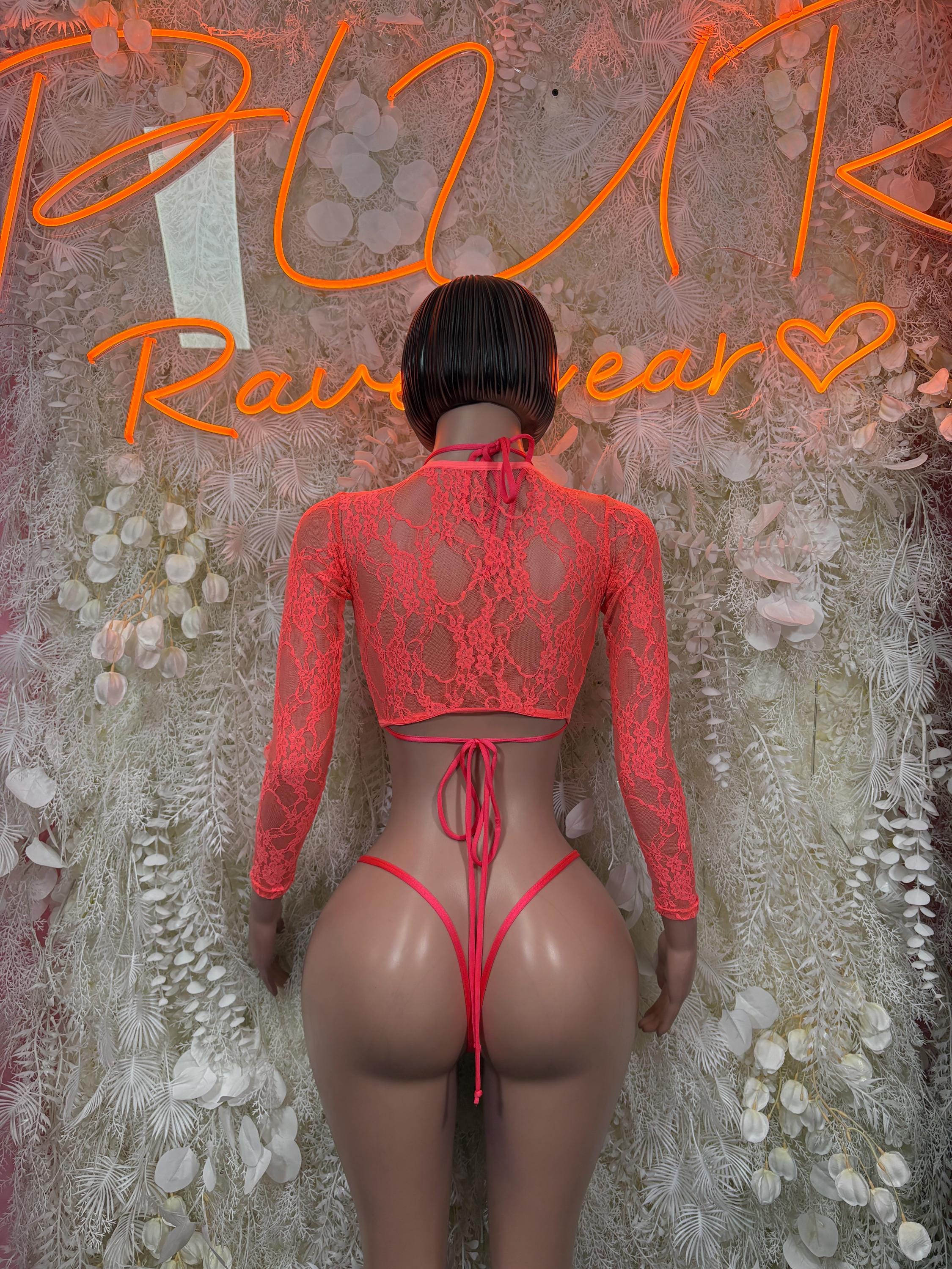 Coral two-piece dancewear set with long sleeves and open-back lace with tied string detail
