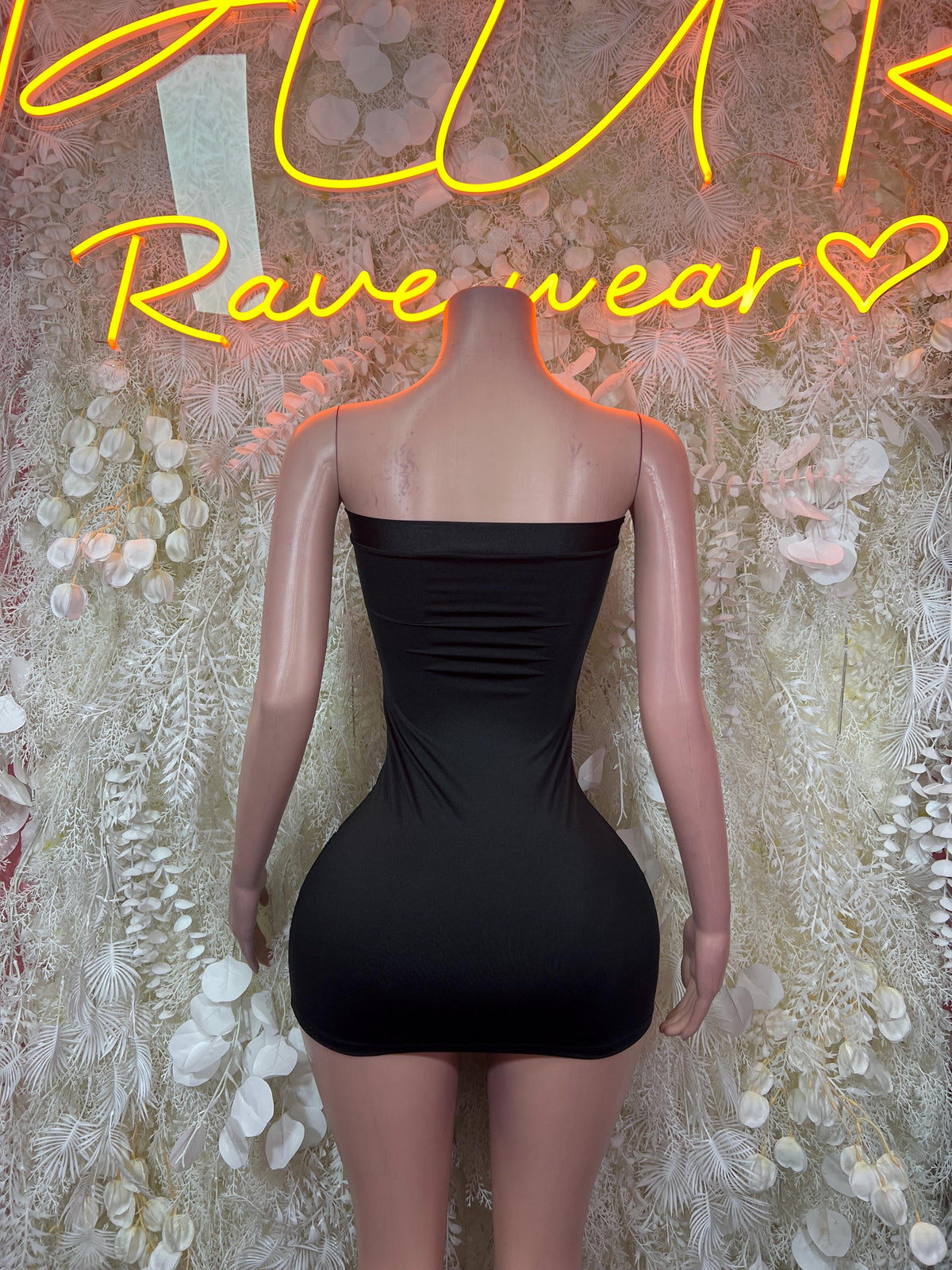 Black strapless fitted mini dress with ruched back and smooth front