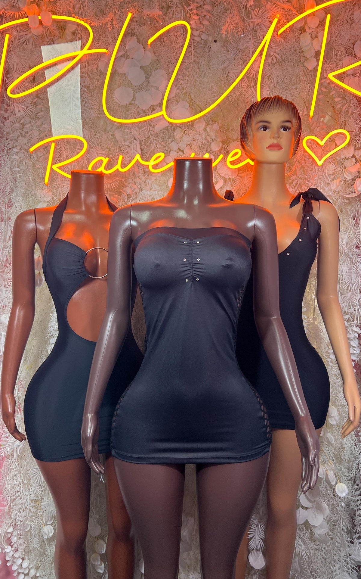 Black mini dress with spaghetti straps shown on mannequins, front and back