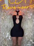 Black mini dress with sweetheart neckline and sheer keyhole cutout, sleeveless