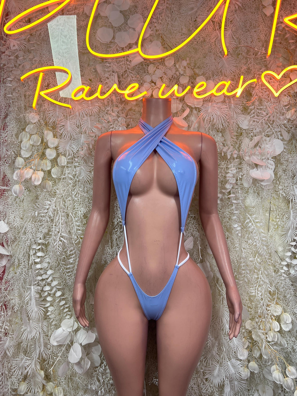 Light blue halter bodysuit with crisscross tie straps and low-back cut