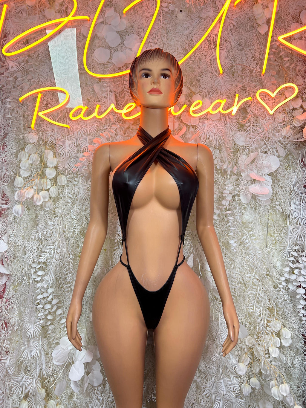 Matte black latex bodysuit with halter neck and high-cut one-piece, open back