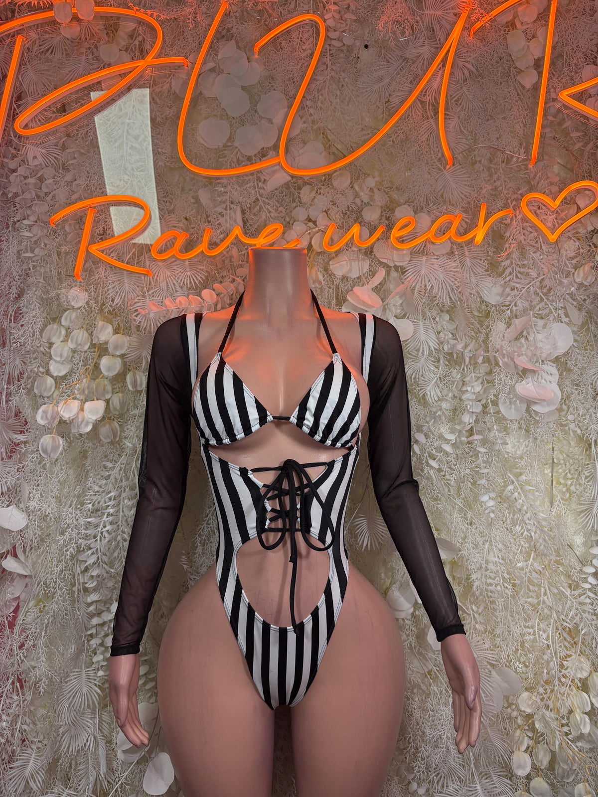 Sports referee bodysuit with black sheer sleeves, striped cups, front lace-up