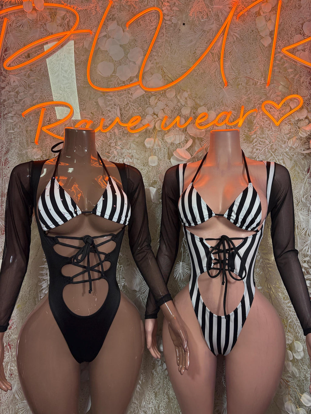 Black referee bodysuit with striped bra, sheer sleeves, front lace-up cutout