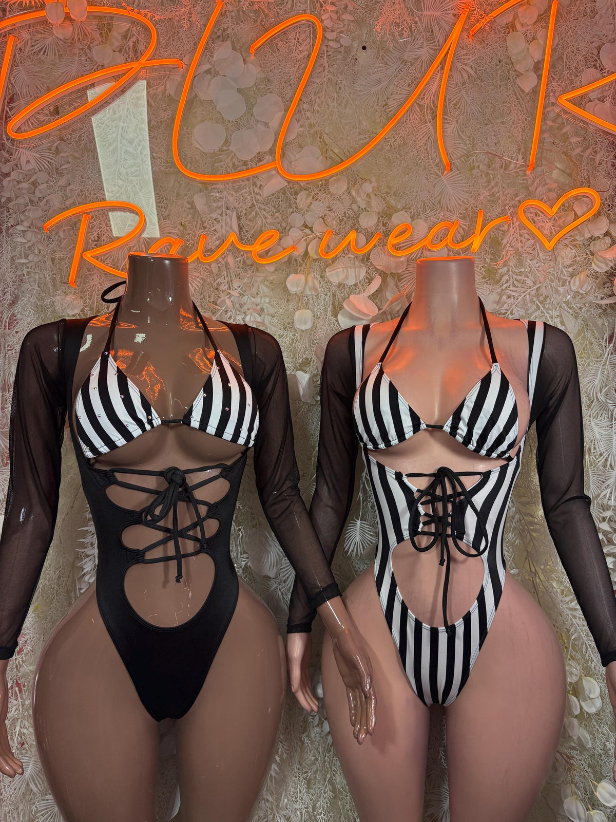 Black referee bodysuit with striped bra, sheer sleeves, front lace-up cutout