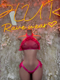 Pink two-piece dancewear set with halter top and ruffle bottoms