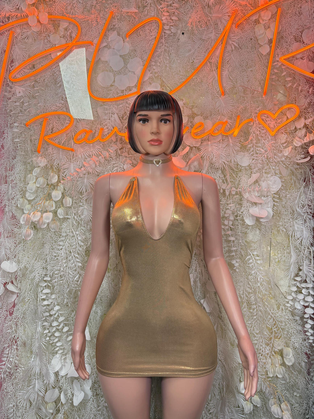 Metallic gold mini dress with halter neckline and choker-style collar, sleeveless
