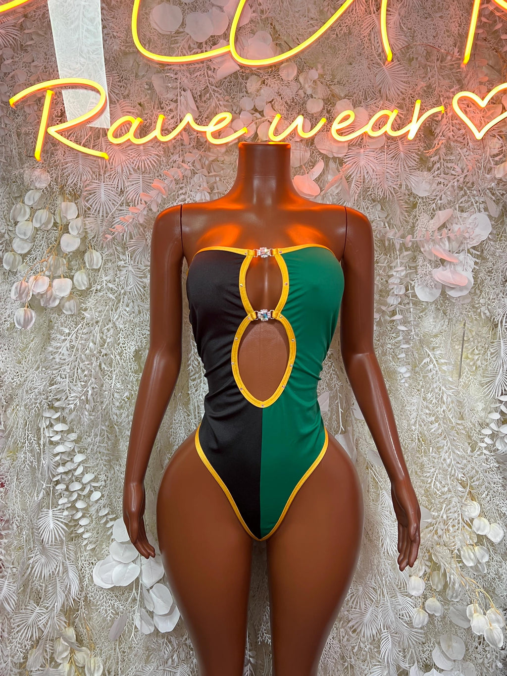 Jamaica flag bodysuit with green side panels, yellow trim, and oval chest cutout