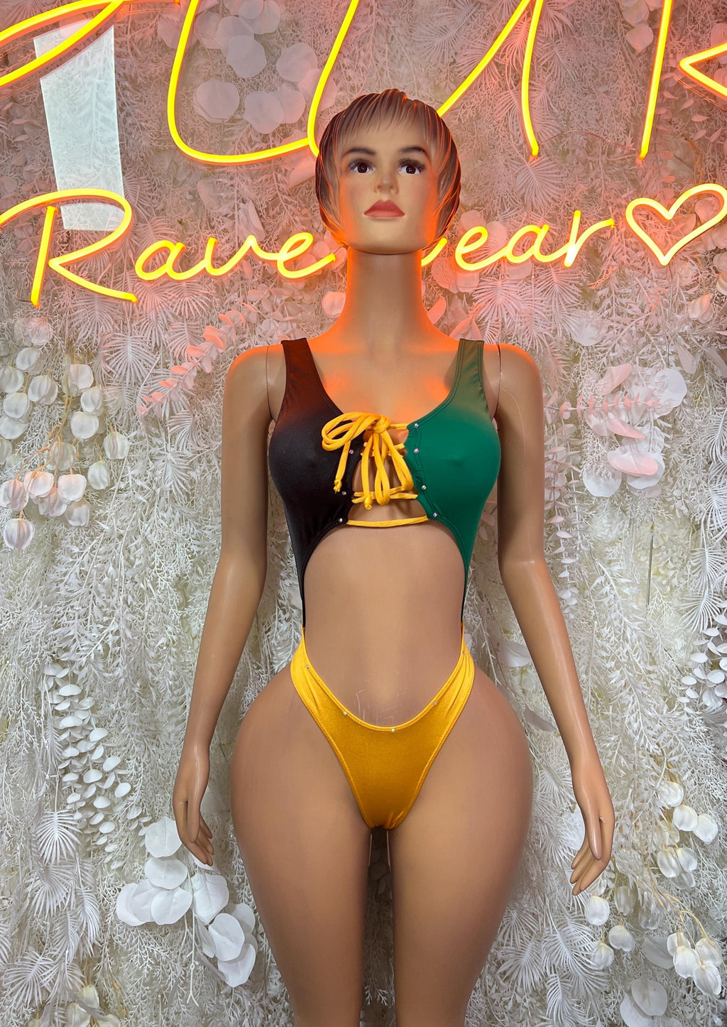 Women’s Jamaica-flag style bodysuit with green, black, and yellow panels, front lace tie