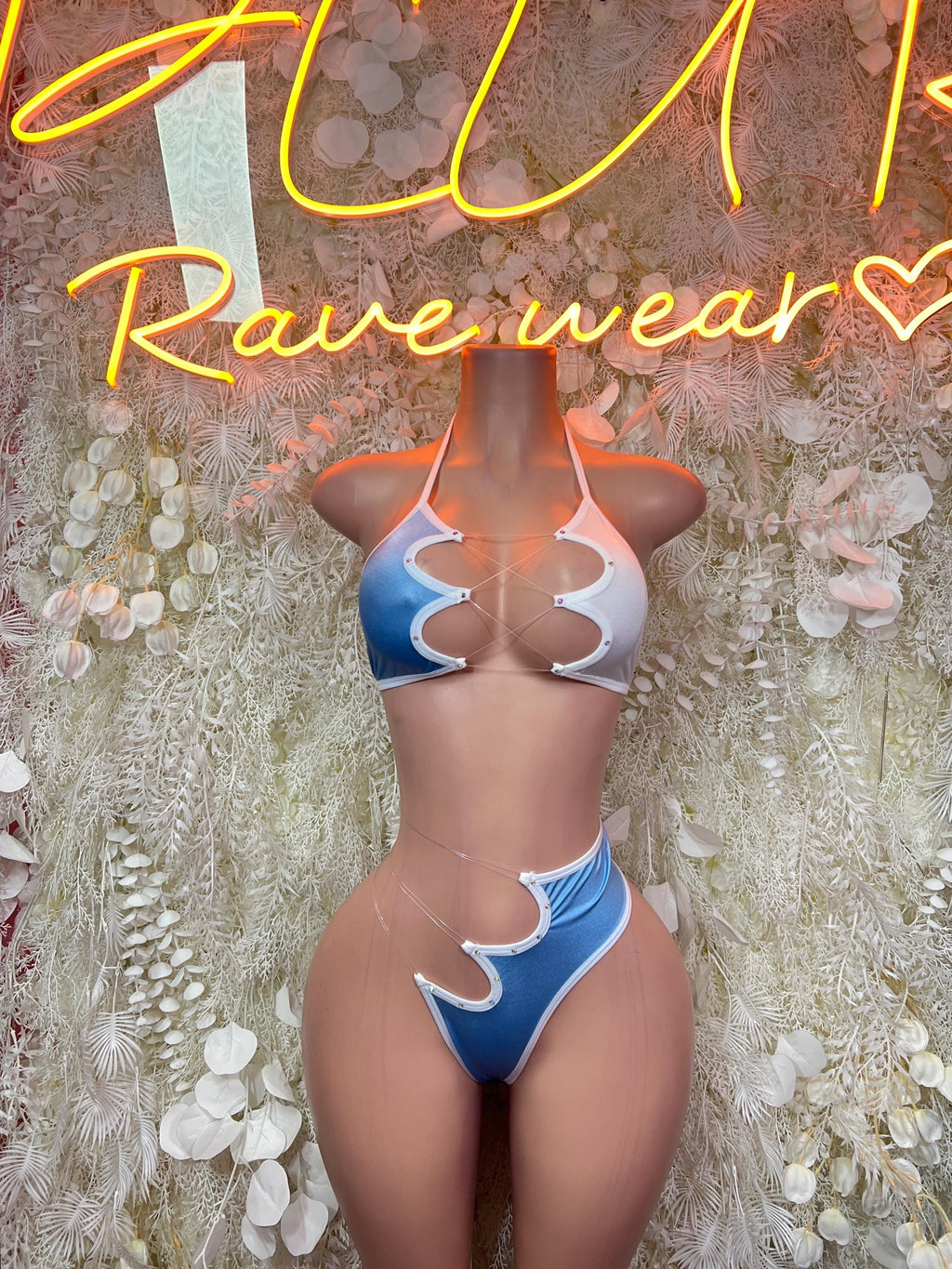 Light blue and white two-piece bodysuit with dark blue side panels and lace-up straps