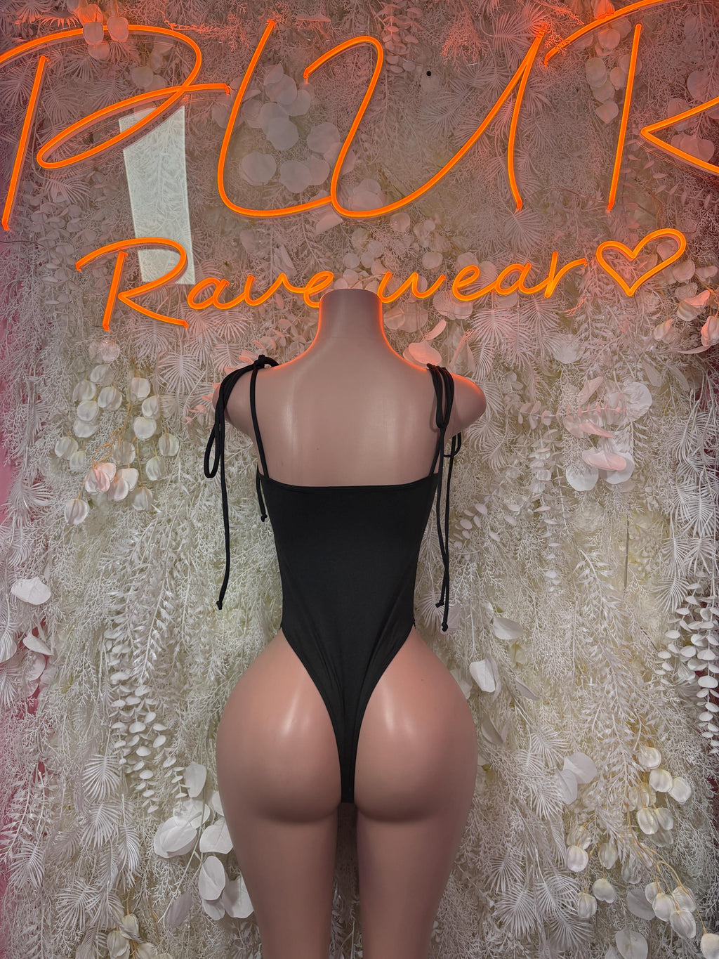 Backless black cheetah-print bodysuit with lace-up crisscross back straps