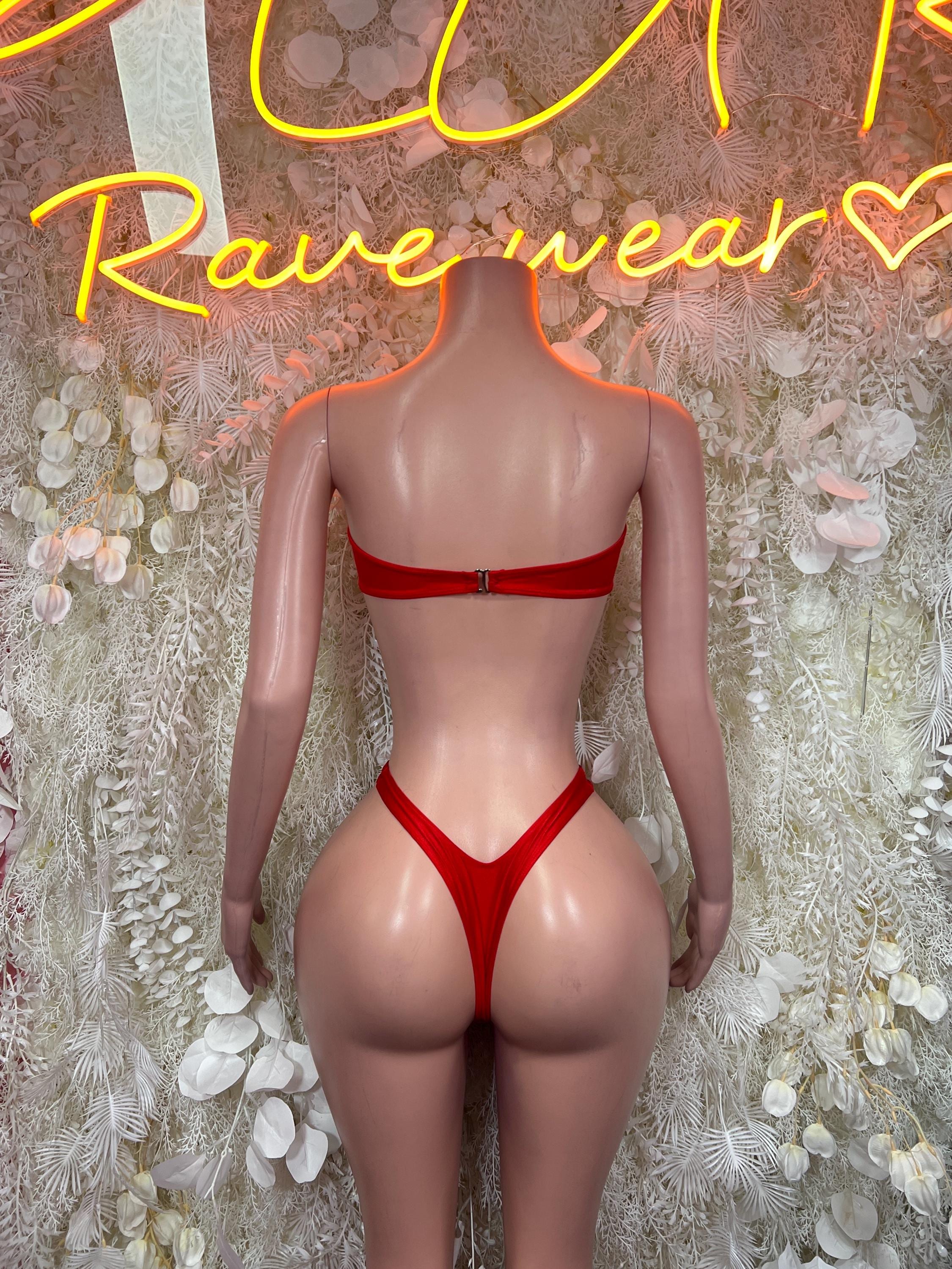 Red one-piece bodysuit back view with wide straps and high-leg cut