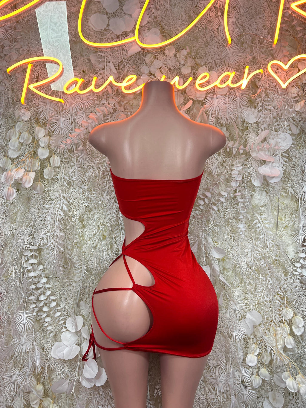 Red strapless mini dress with ruched side cutouts and thin tie straps
