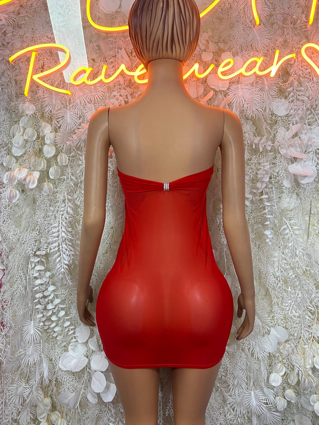 Red backless strapless mini dress with center clasp detail and ruched seams