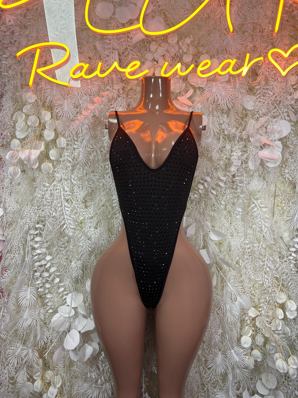 Black rhinestone V-neck bodysuit with thong-cut legs and adjustable straps