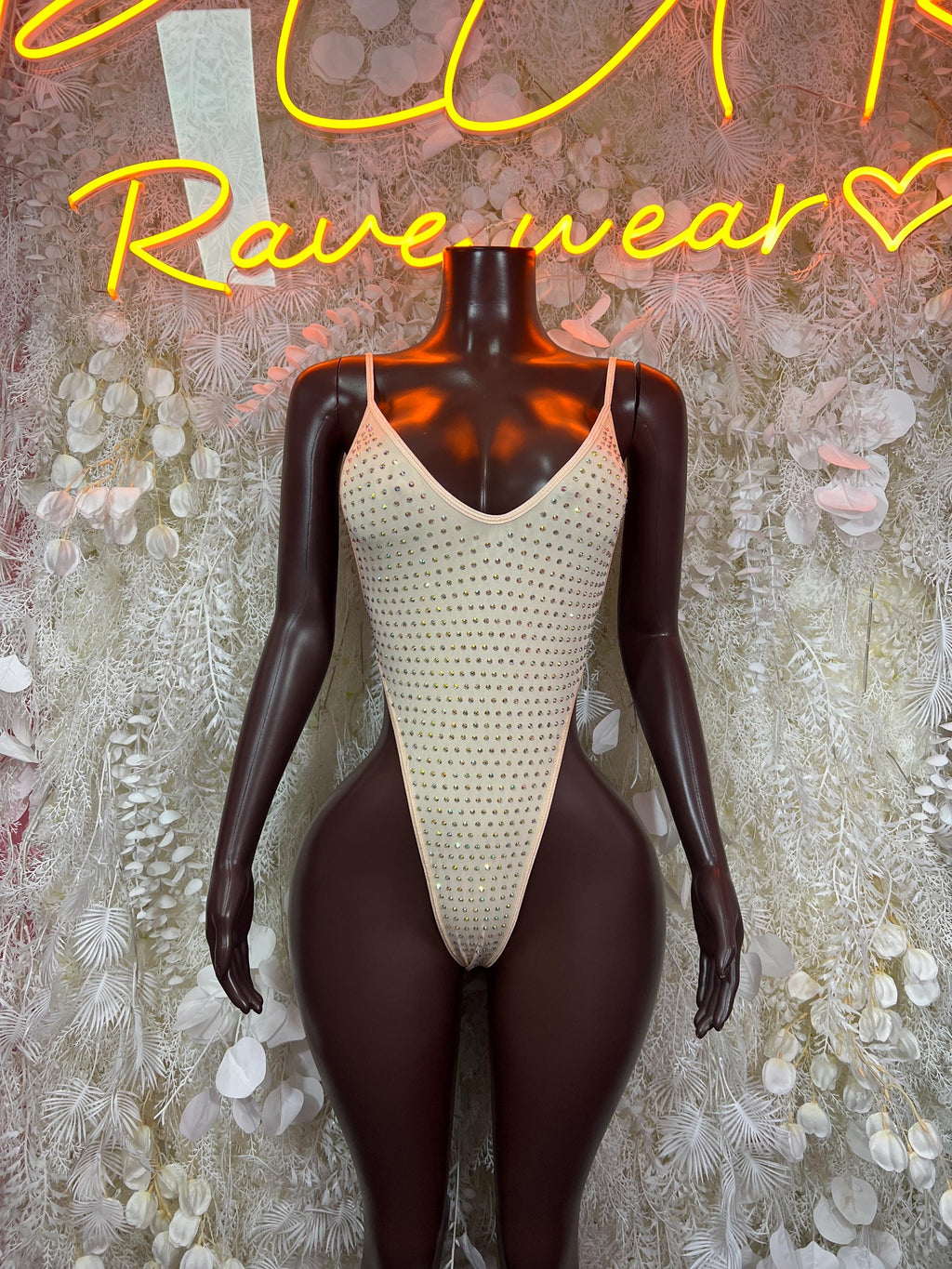 Rhinestone bodysuit with nude base and V-neck, sparkling texture