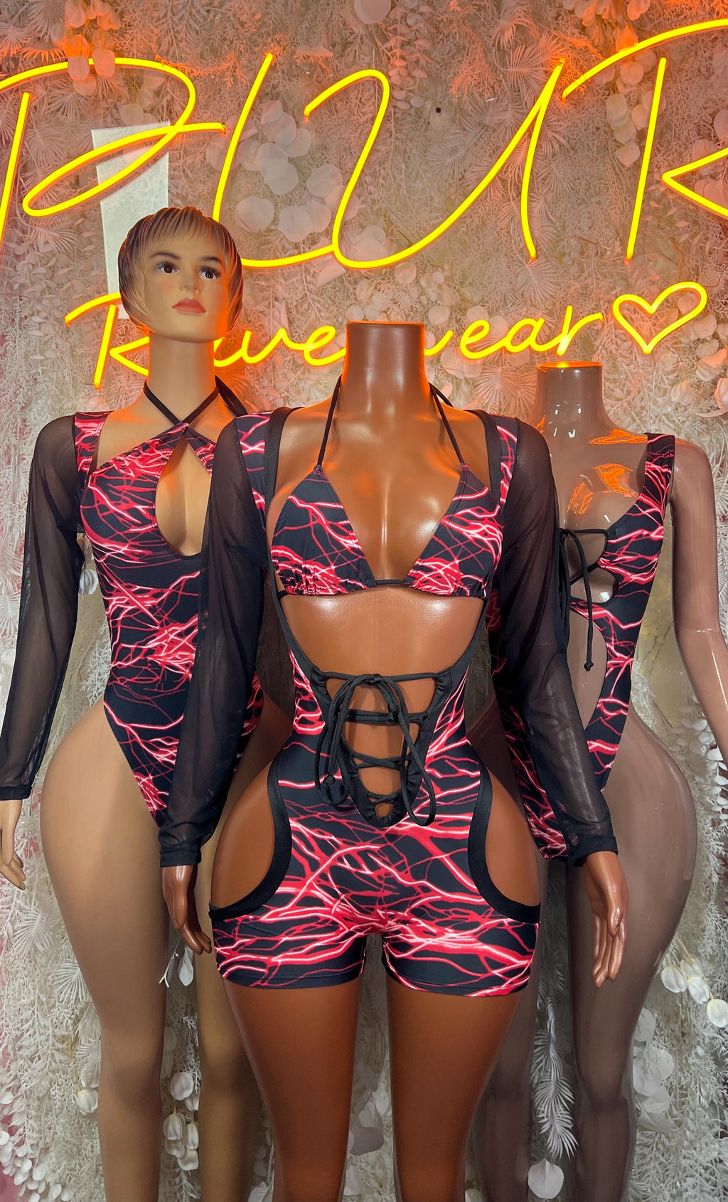 Red lightning print one-piece bodysuit with sheer sleeves, front lace-up and cutouts