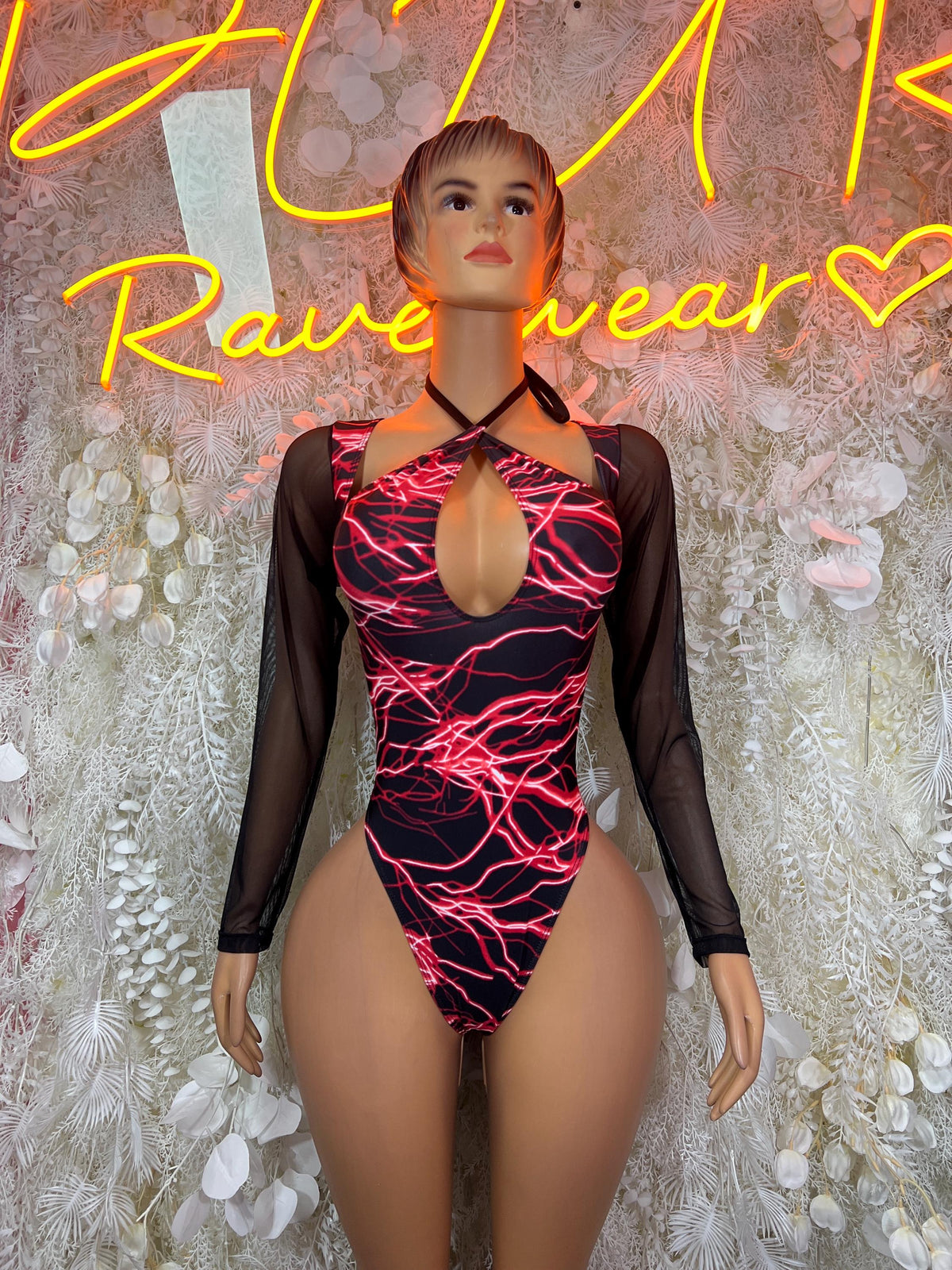 One-piece bodysuit with red lightning print, black sheer sleeves, deep front keyhole