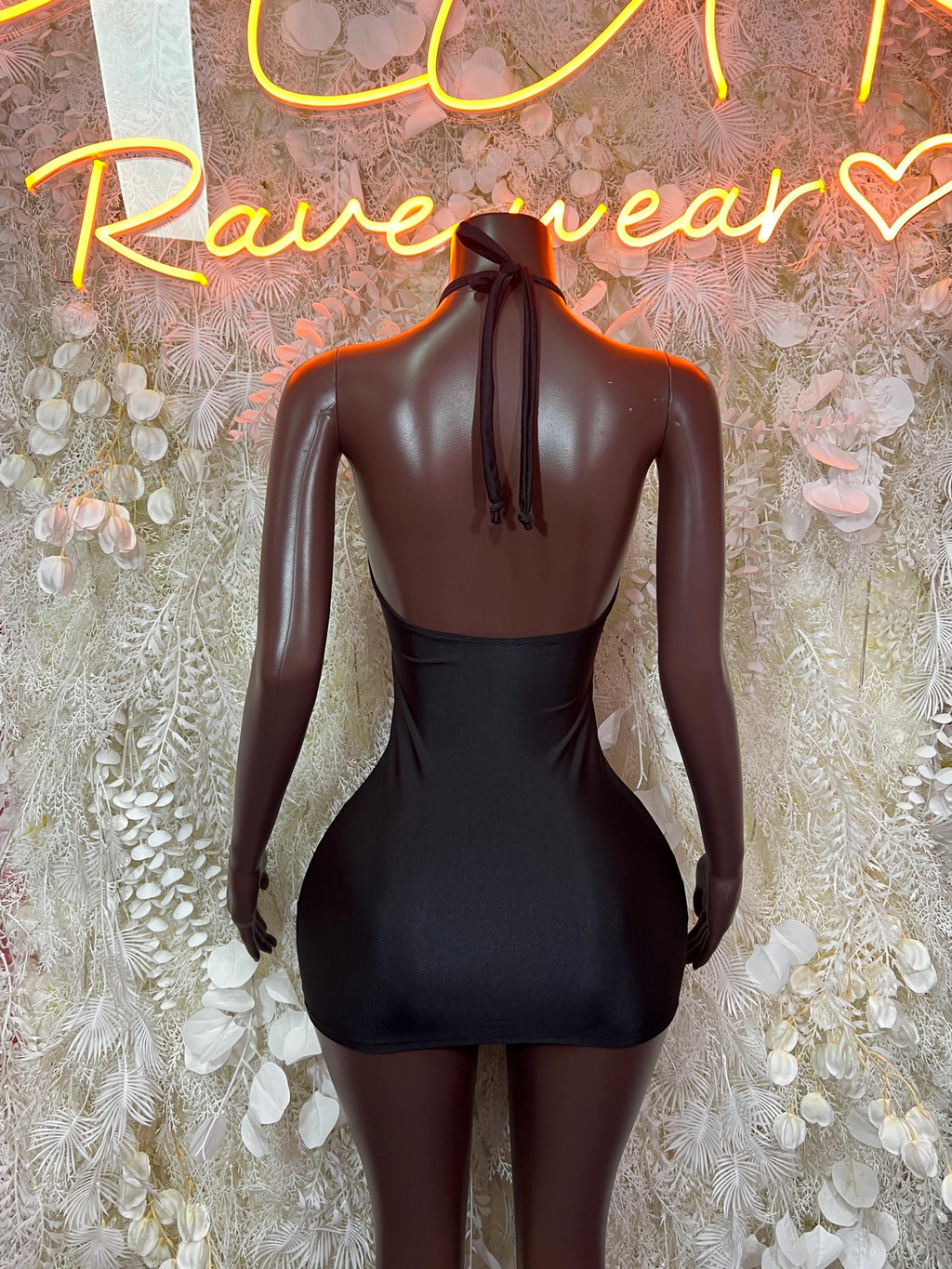 Black halter mini dress with open back and draped neck ties
