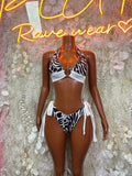 Zebra print two-piece swimwear with white tie-front top and high-cut bikini bottoms