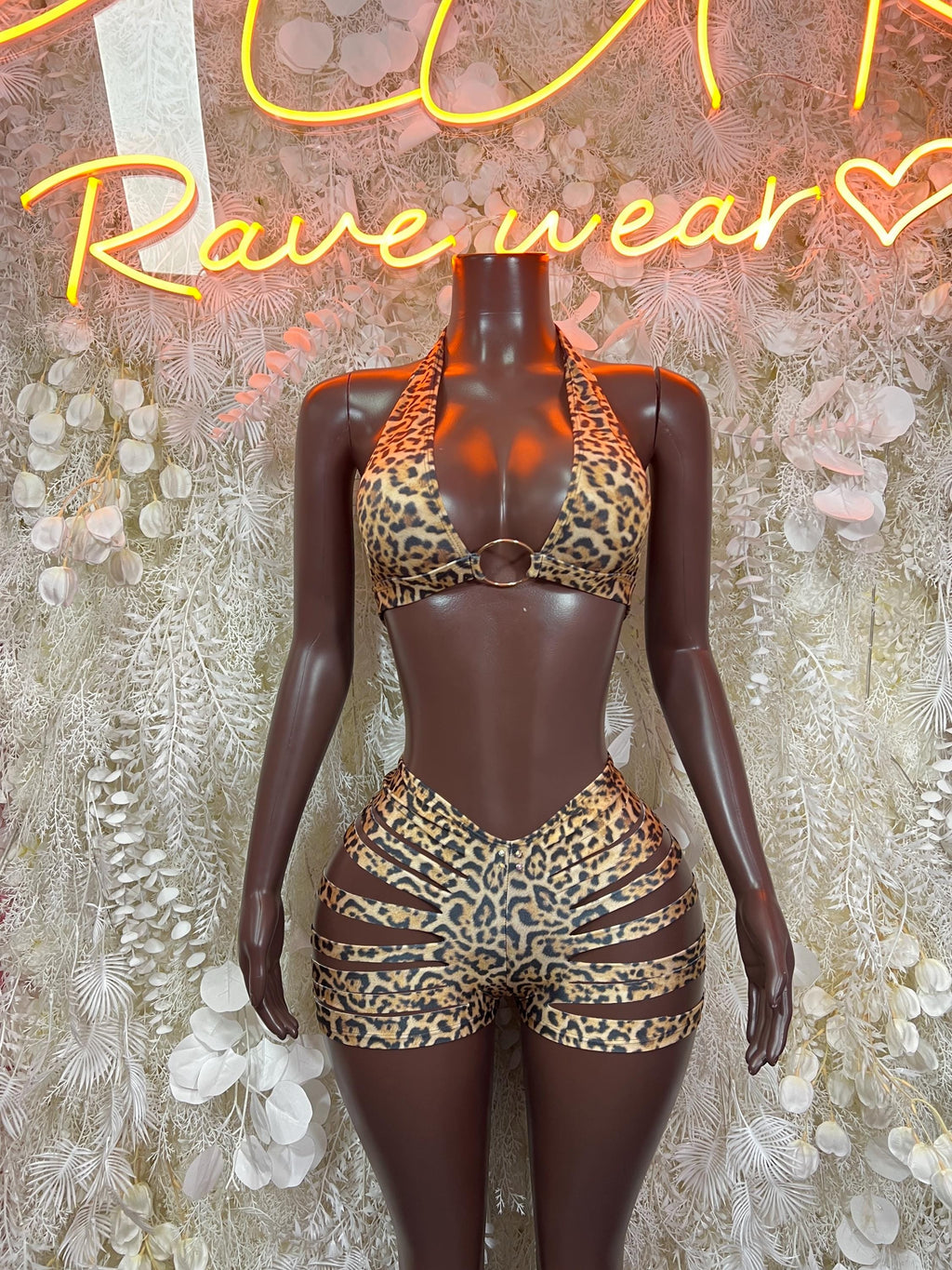 Leopard-print two-piece swimwear set with triangle top and matching high-waist bottoms