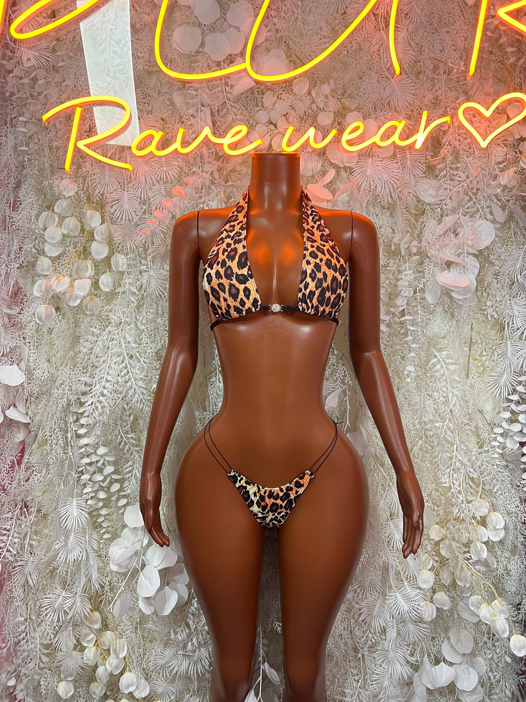 Leopard print two-piece bikini set with triangle bra and tie-back thong bottoms