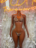 Leopard print two-piece bikini set with triangle bra and tie-back thong bottoms