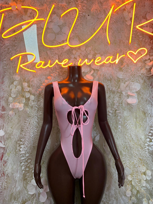 Pink lace-up sleeveless bodysuit with oval cutout and low back