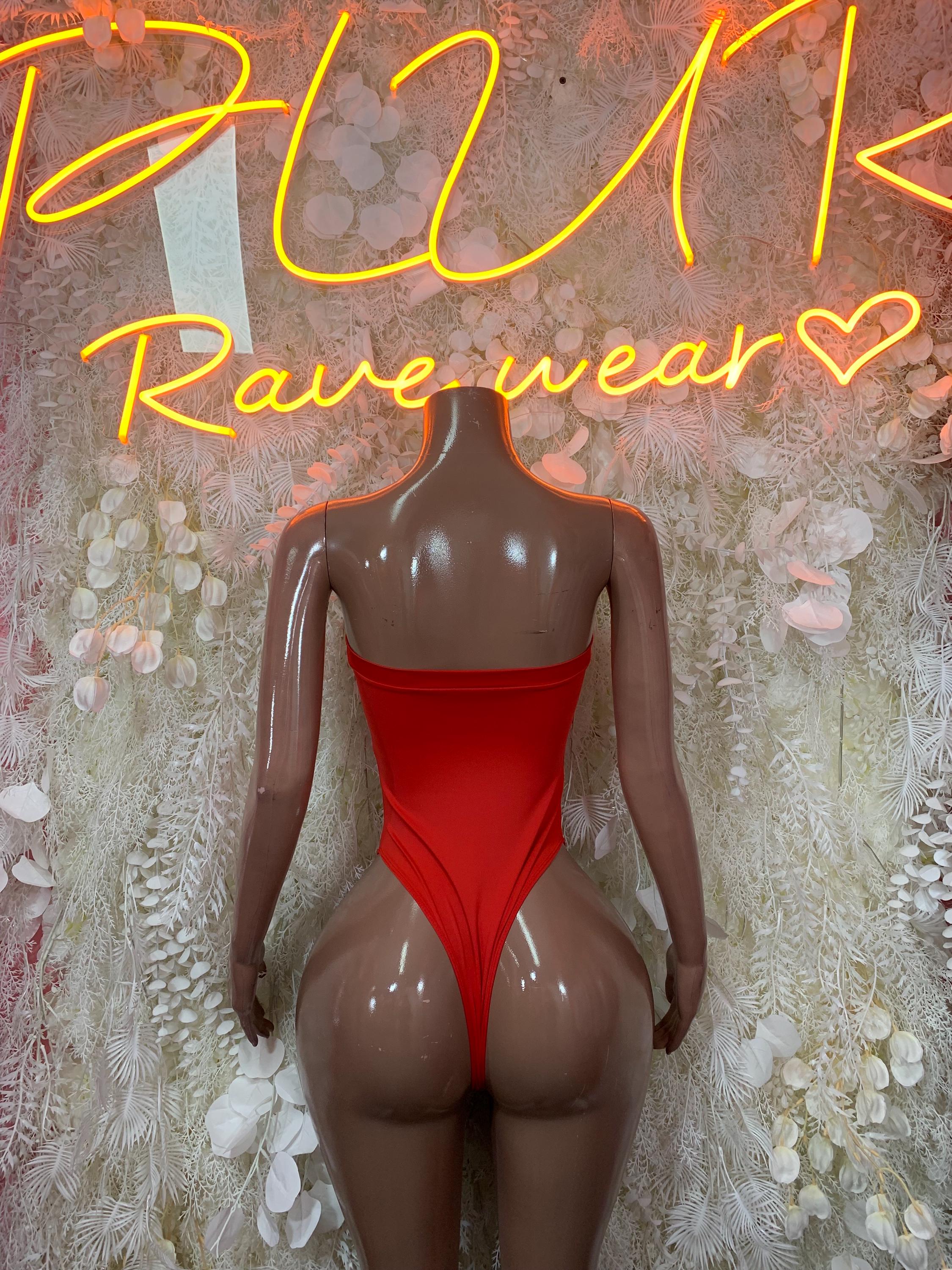 Red one-piece bodysuit with open back and halter-style straps