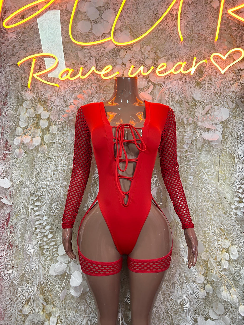 Red one-piece bodysuit with lace-up front, mesh sleeves, and high-cut thigh straps