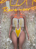 Yellow latex bodysuit with white fringe cups and high-cut one-piece, tie-back straps