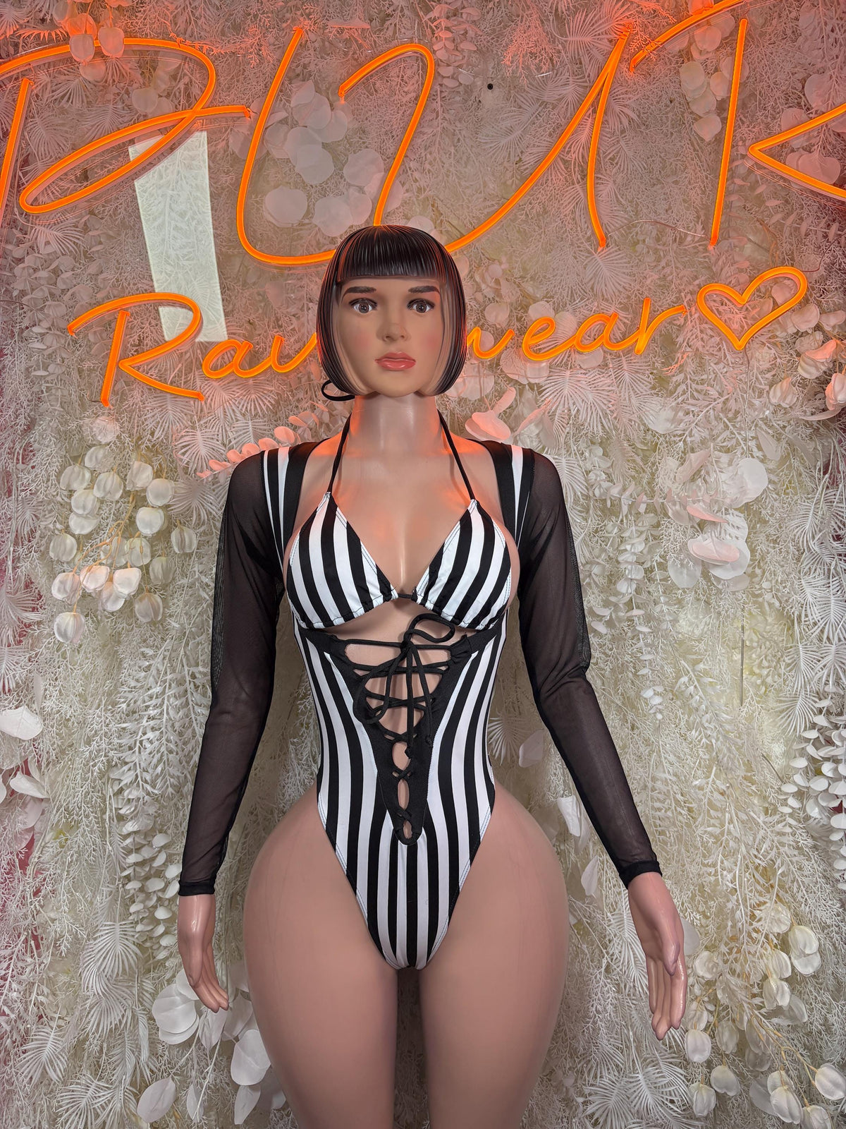 Referee-style striped bodysuit with black long sleeves and lace-up front