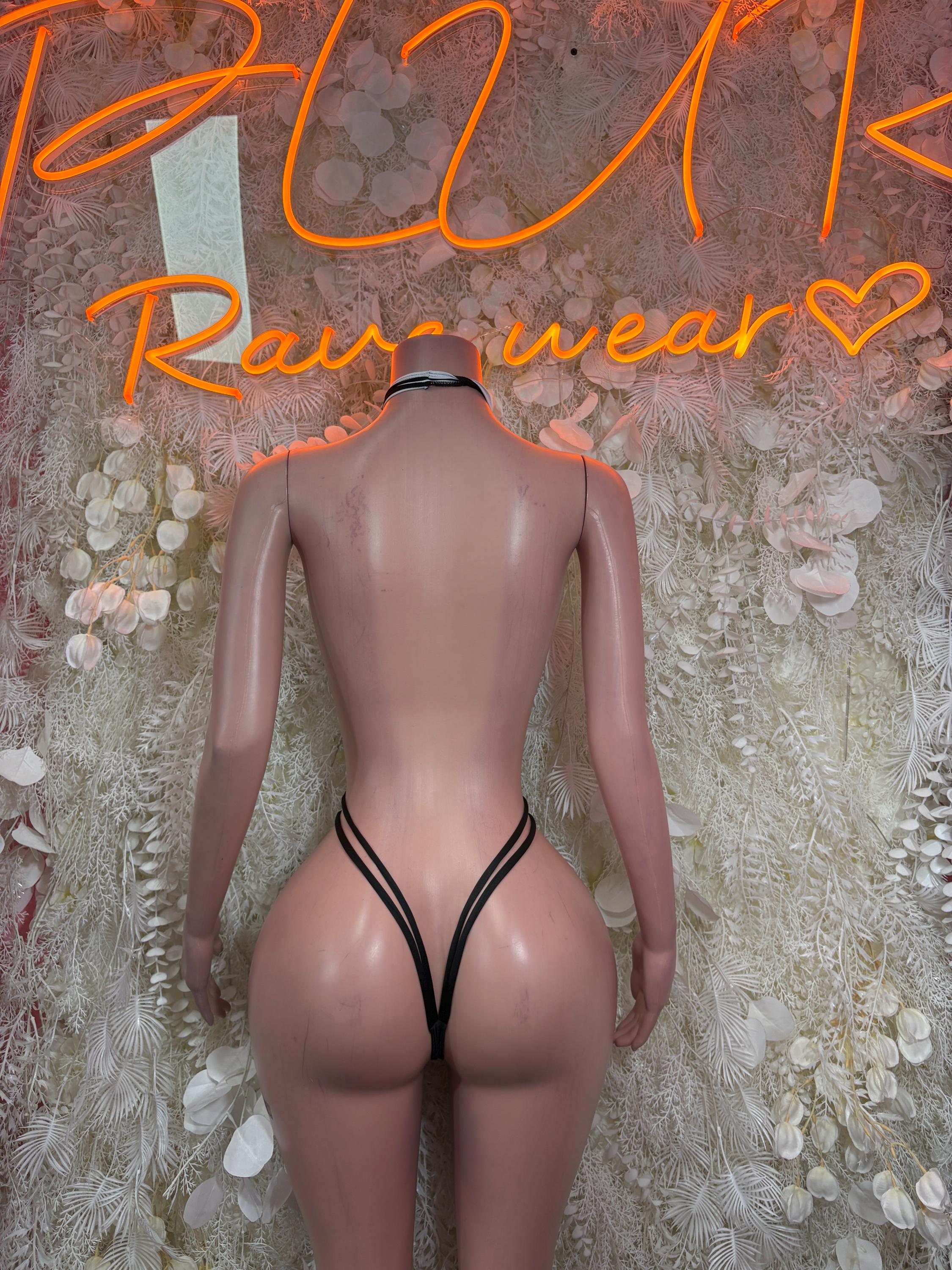 Referee-style bodysuit back view with black halter straps and striped cutout.