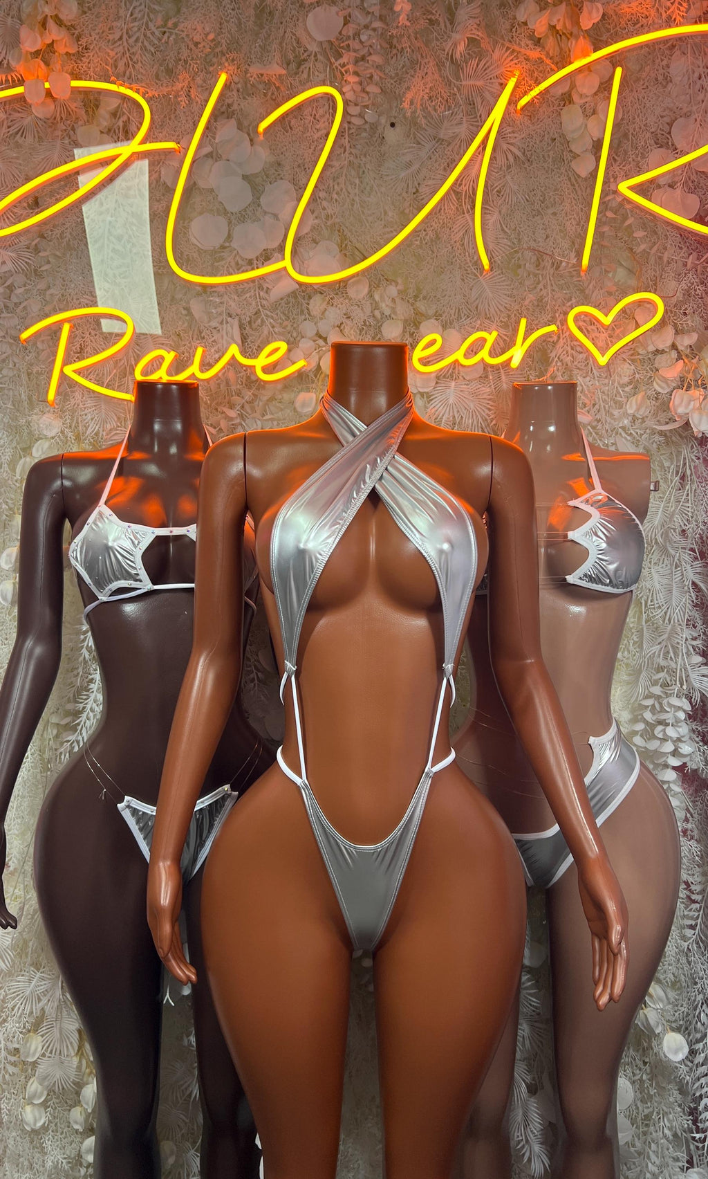 Metallic silver latex bodysuit on models, halter front with open back straps