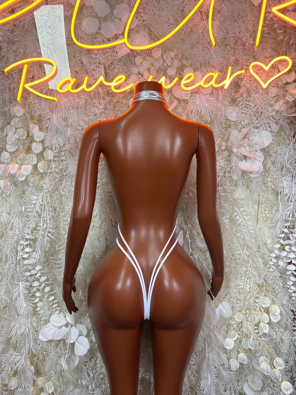 Metallic silver latex bodysuit with open back and thin crisscross straps