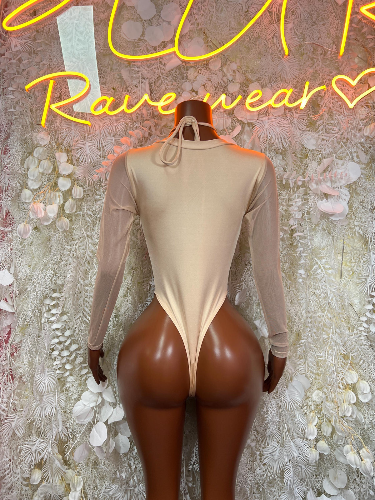 Back view of champagne gold lace bodysuit with long sheer sleeves and V-back