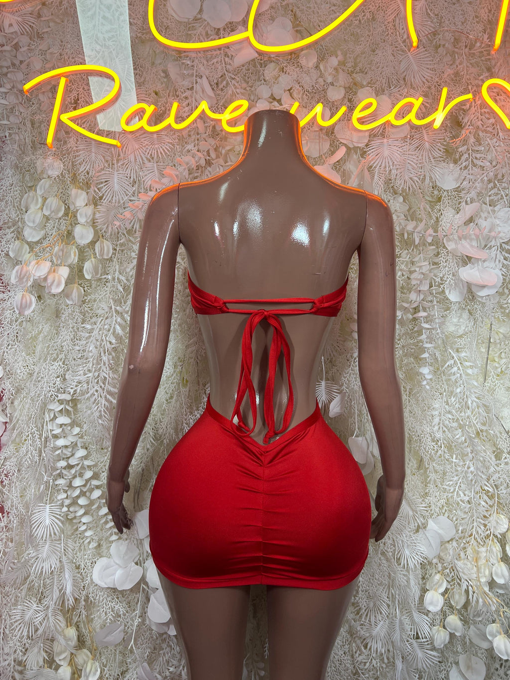 Red mini dress, back view, open strap design with bow tie