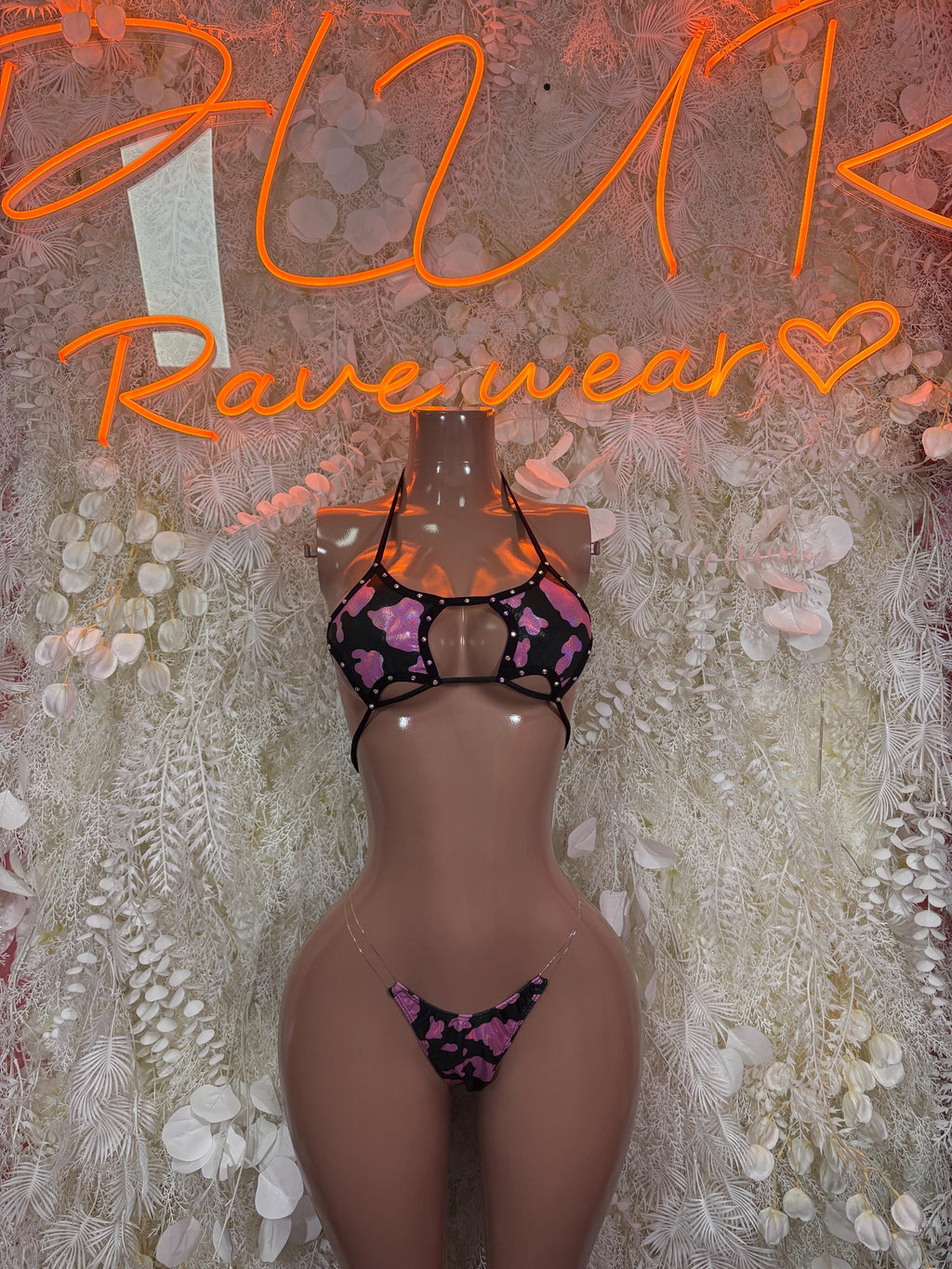 Pink cow print halter monokini thong with open back and strappy design