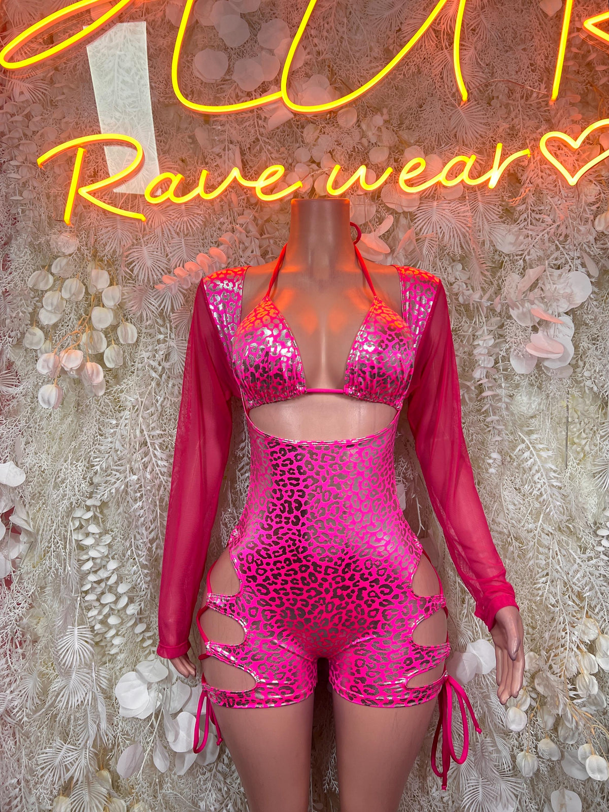 Hot pink metallic cheetah bodysuit with long sleeves, cutout sides, tie closures