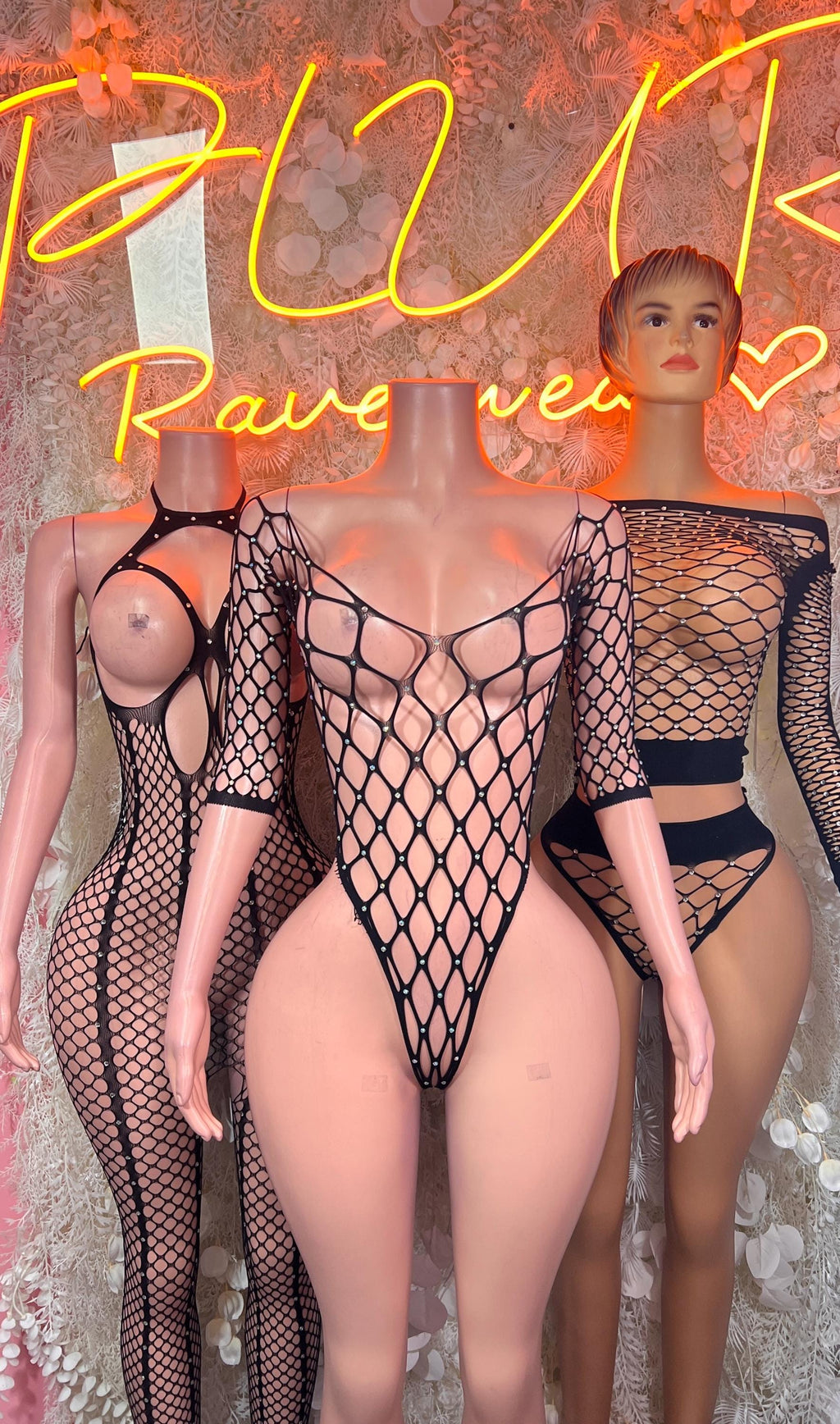 Black long-sleeve fishnet bodysuit with diamond net, open back and high-cut leg