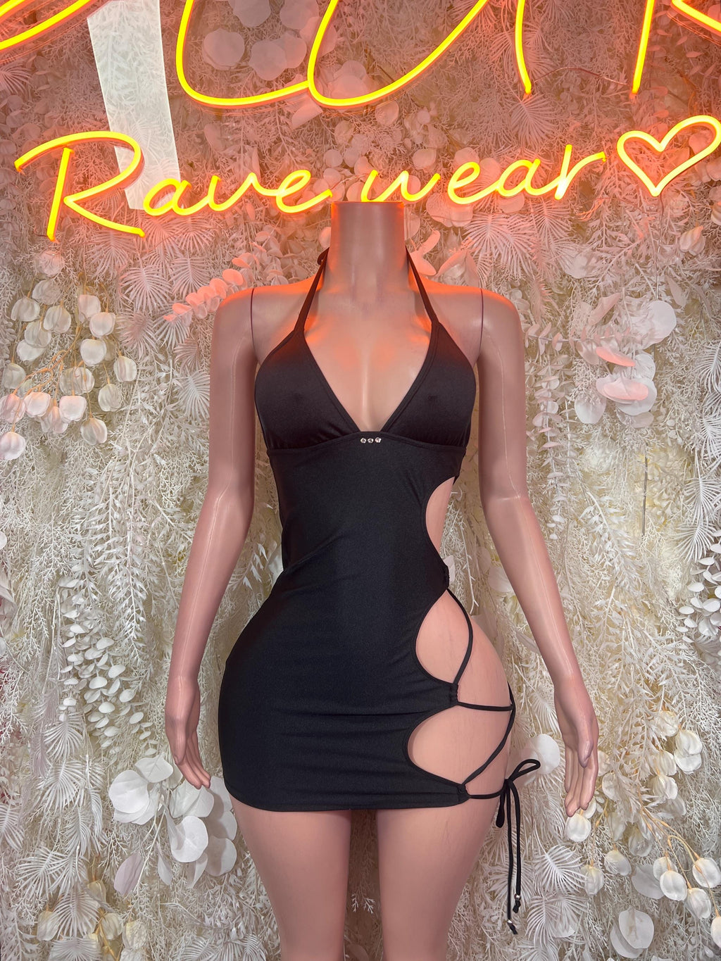 Black cutout halter mini dress with lace-up side ties, bodycon fit