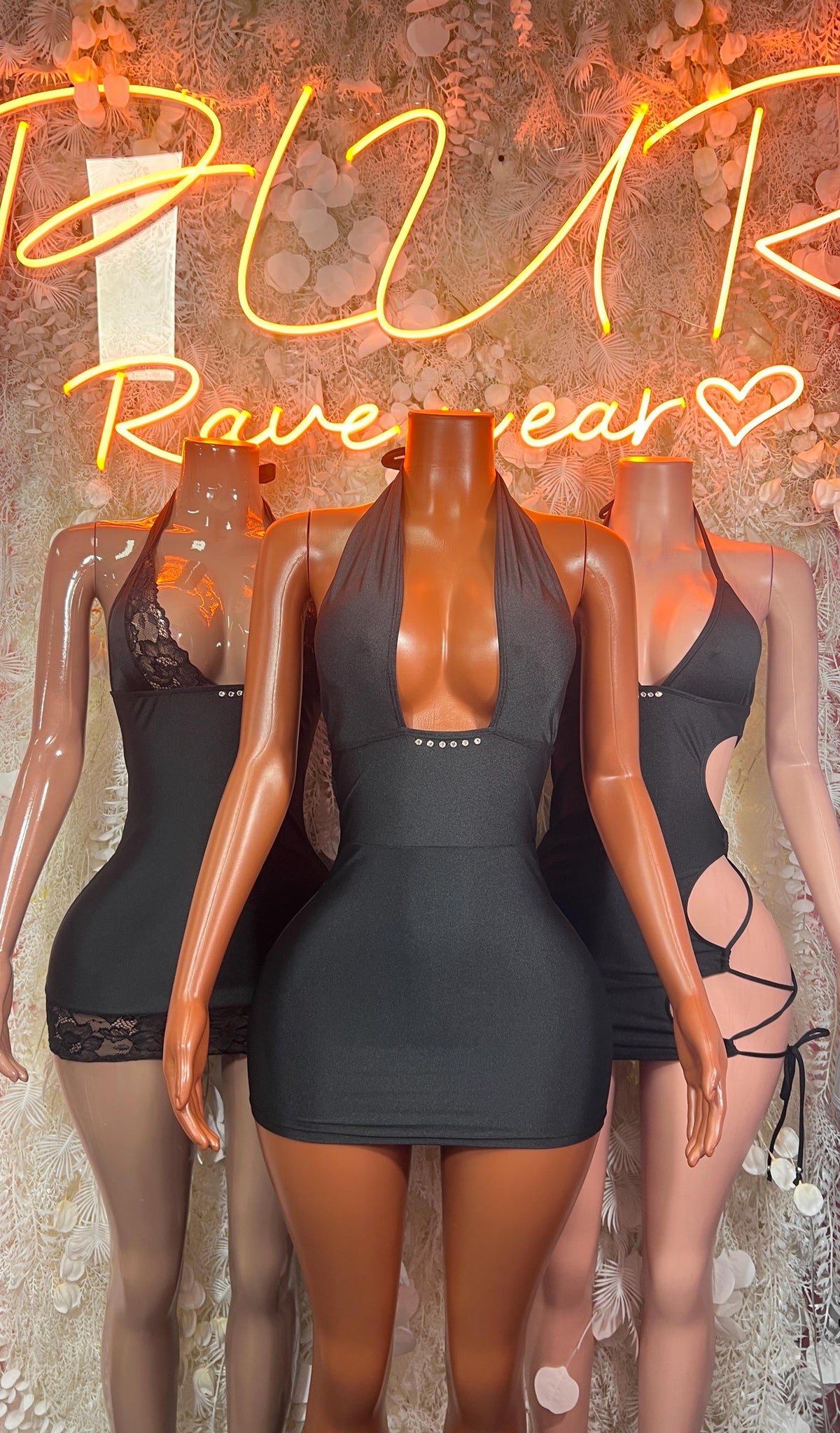 Black halter mini dress with square chest cutout and lace-up side ties
