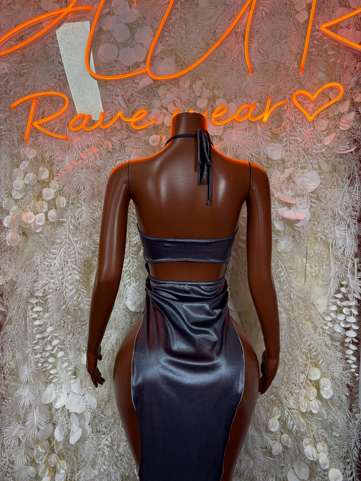 Back view of dark metallic satin halter maxi dress with center lace-up